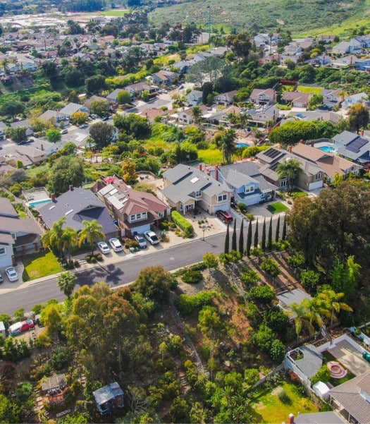 Aerial view of Rancho Santa Fe showcasing a picturesque neighborhood with homes perfect for converting a garage to a living space, blending luxury and functionality in this scenic area.